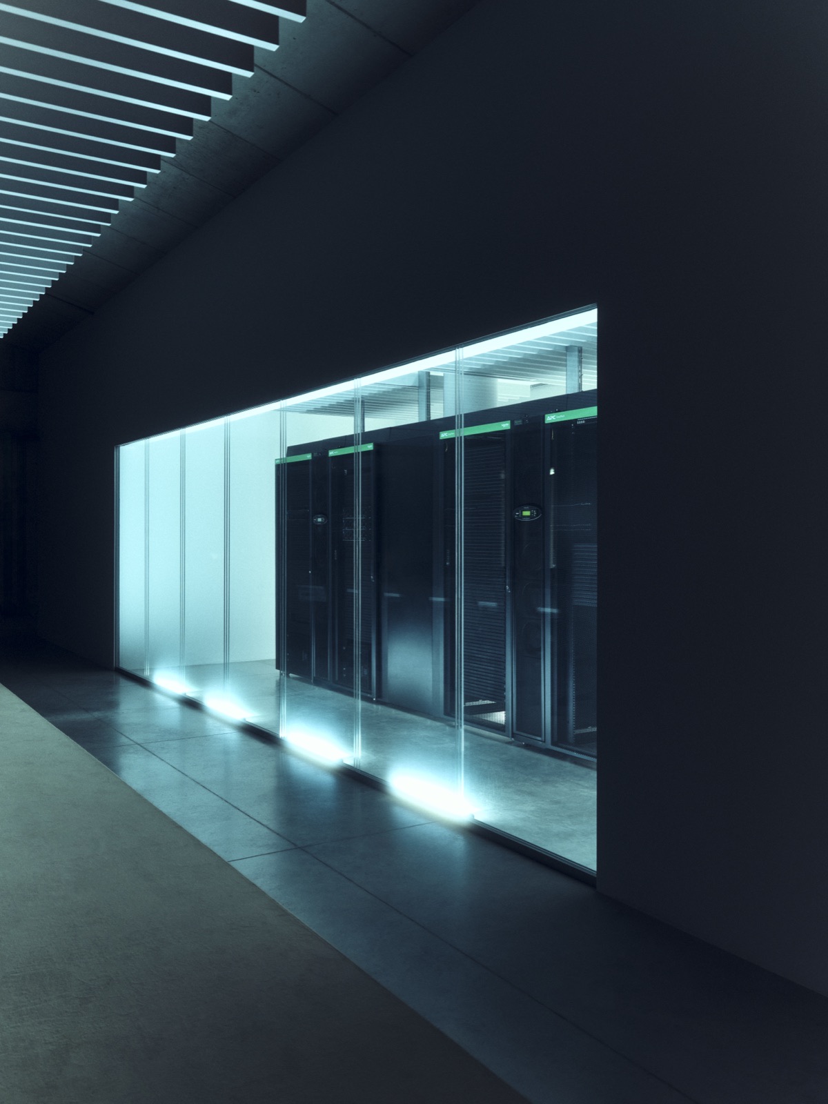 Glass-walled server room.