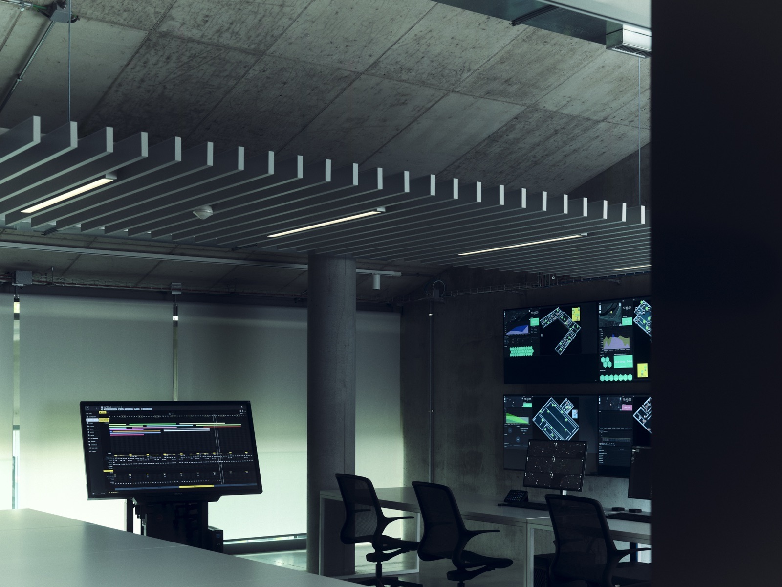 Control room, angled monitors.