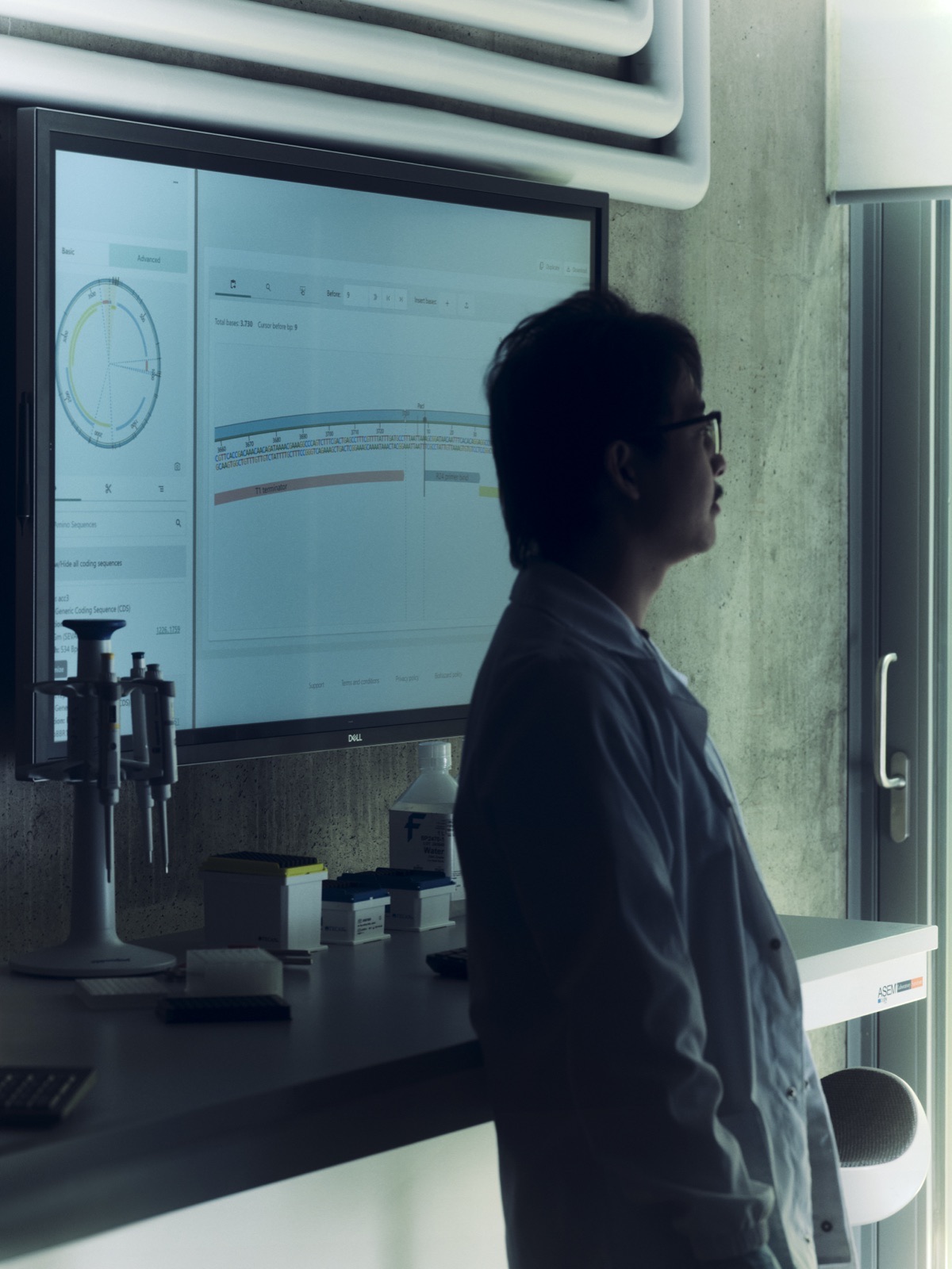 Researcher at the genomics screen.