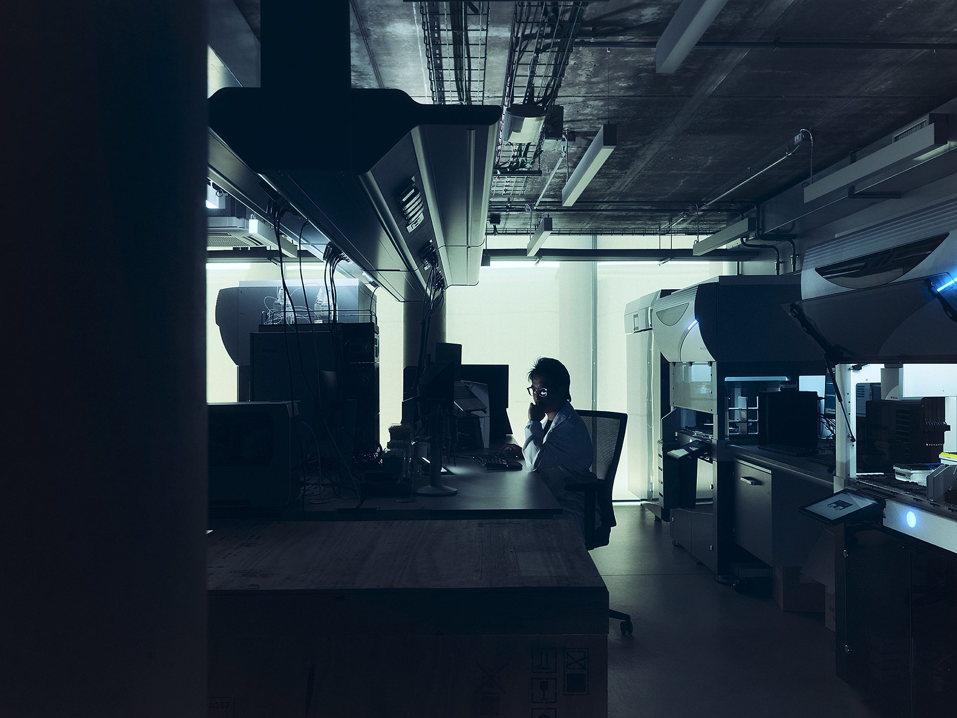 A researcher at a workstation among the FFI laboratory instruments.